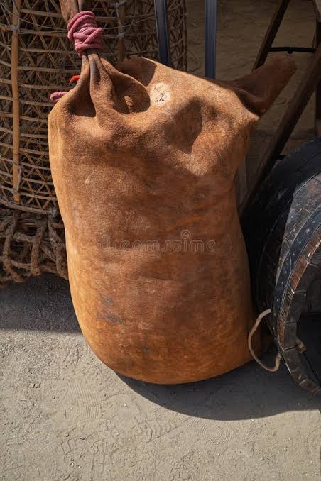 A great ox-hide bag, its mouth gathered and bound with cord β this is a gift.